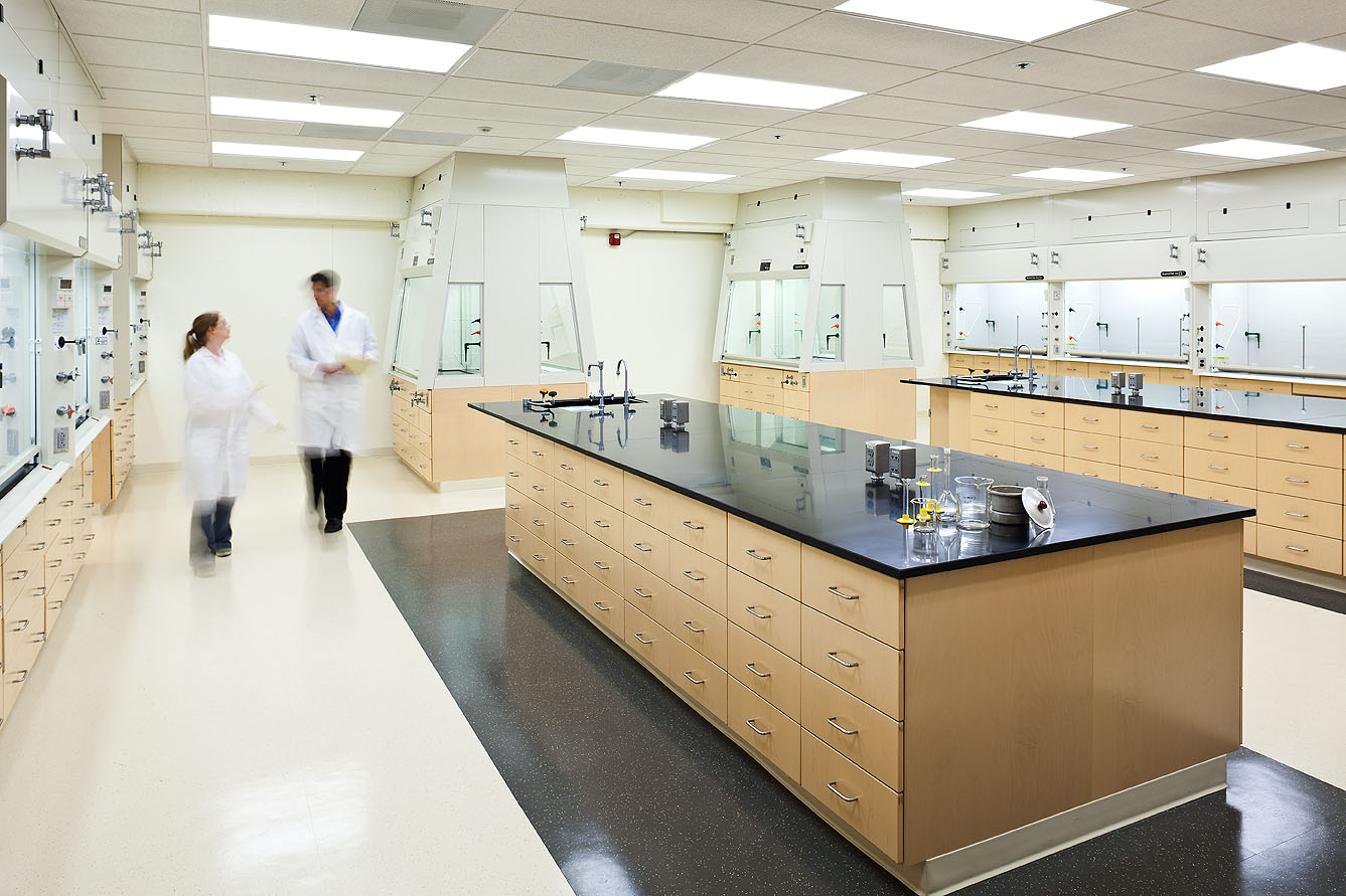 Portland State University teaching laboratory w/ male technician in lab coat.