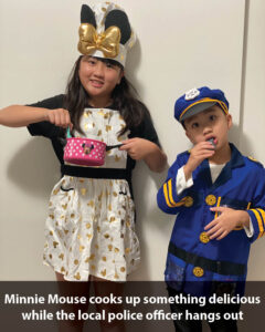 a boy and girl wearing costumes