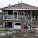 a heavily damaged house