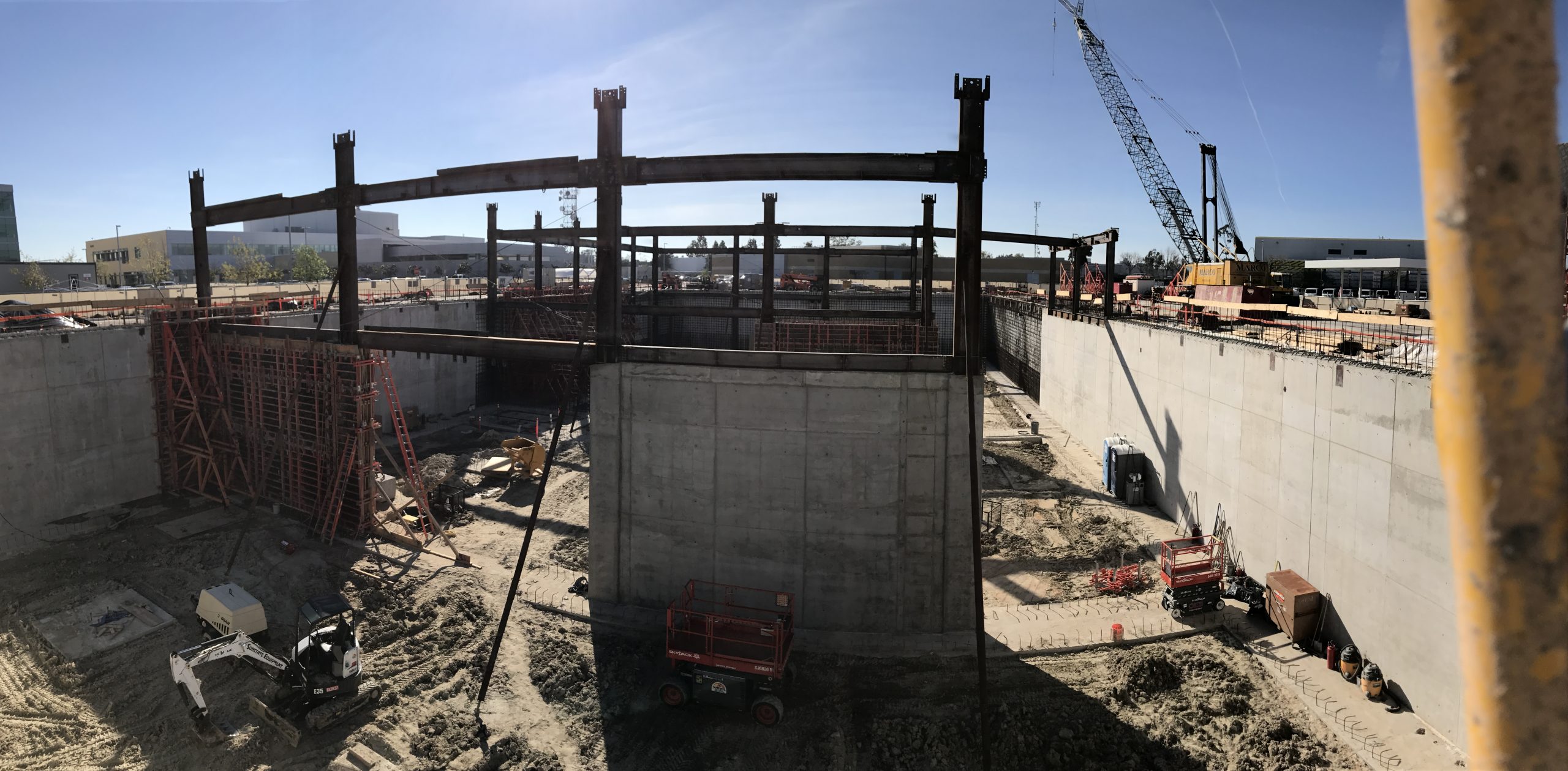 a construction site with a few cranes