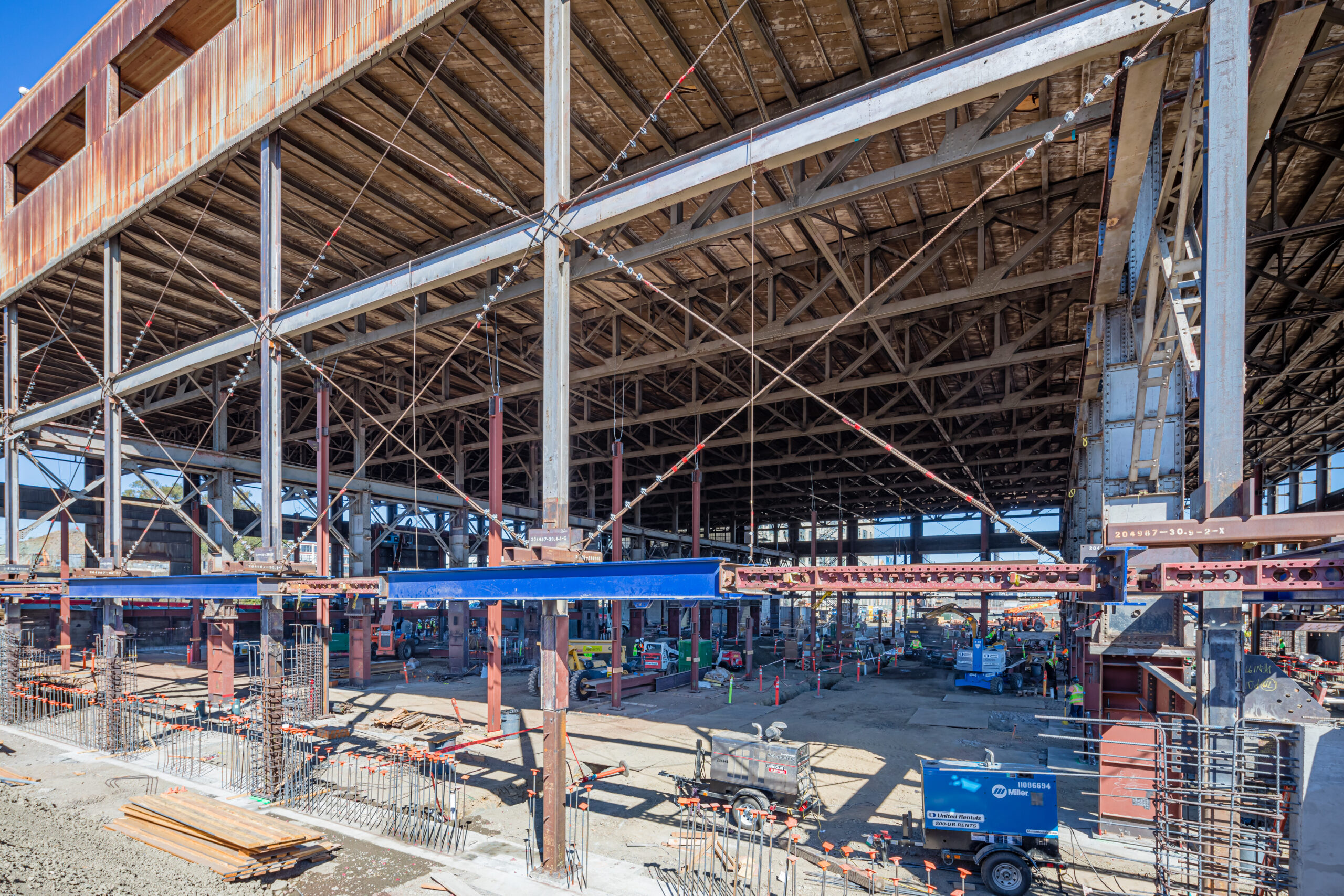 a large warehouse with many beams under construction