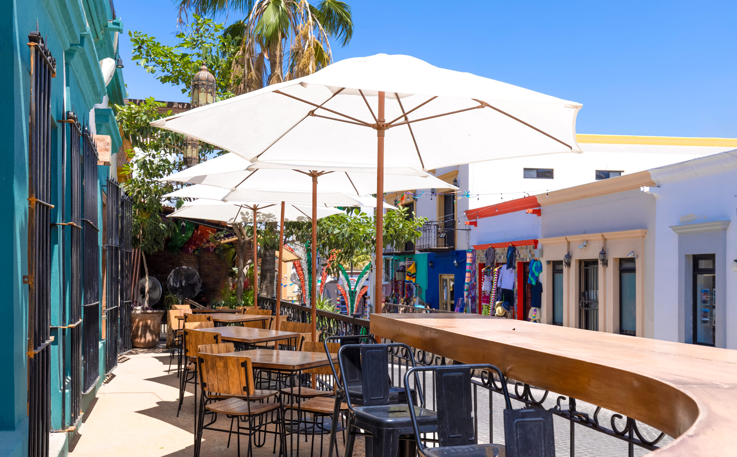 a patio with tables and chairs