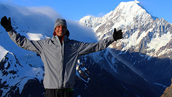 a man standing on a snowy mountain