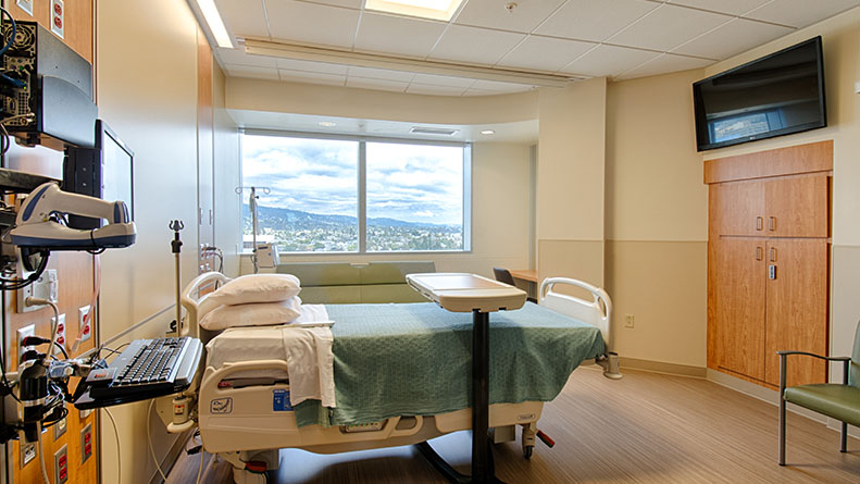 a room with a bed and desk